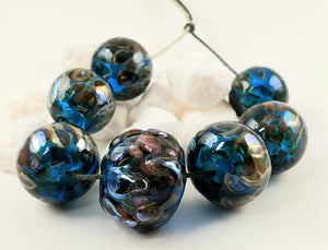 Handmade lampwork beads used as components for finished jewelry designs